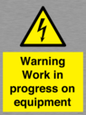 warning-work-in-progress-on-equipmentwith-electrical-hazard-symbol~